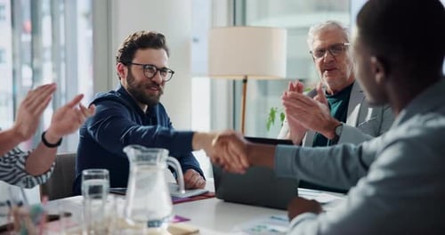 Businessman, group and applause for handshake at office meeting, success