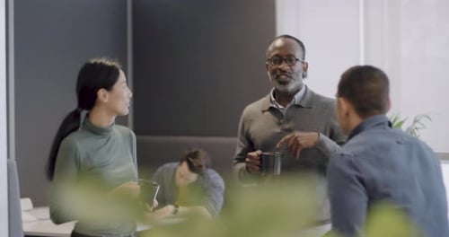 Casual Business Team Meeting Standing in Office Discussing