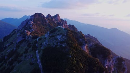 View From Above a Beautiful Aerial View of a Craggy Mountain Peak in Carpathians During a Sunset