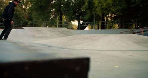 Skateboarder Performing Trick in an Urban Skatepark