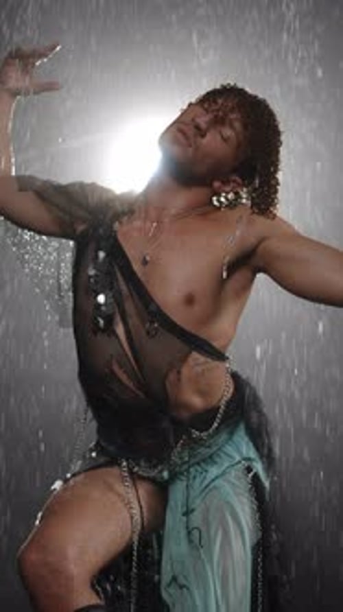 A Captivating Dynamic Dance Performance in the Rain Featuring Dazzling and Elegant Attire