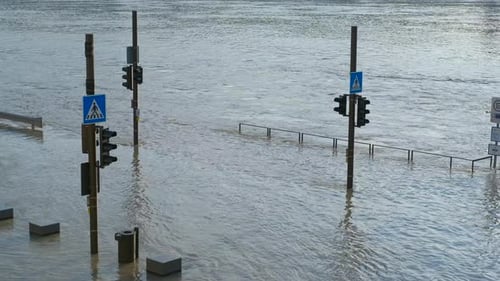 Floodwaters Submerging a Pedestrian Crossing
