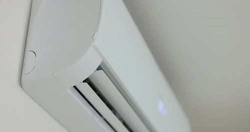 Close Up of a Air Conditioner Turning on and Opening Its Air Outlet Modern Air Conditioning