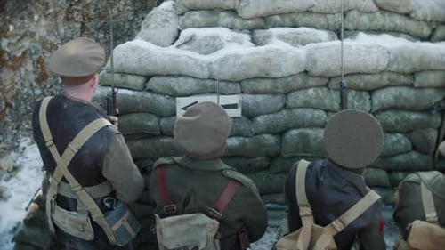 British World War One soldiers prepare to go over the top of the trench to attach the German army in
