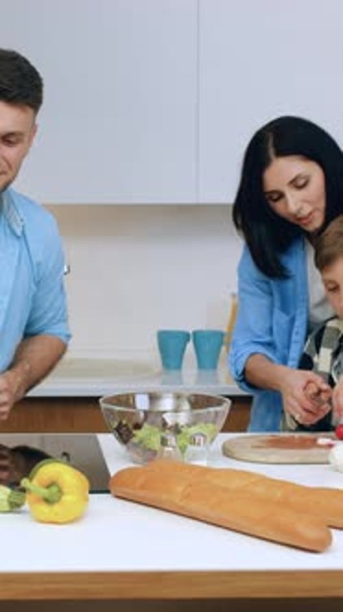 Family Prepares Healthy Meal Together in Bright Kitchen