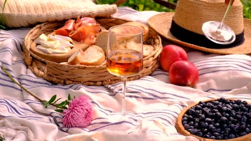Picnic scene with rose wine and fresh food