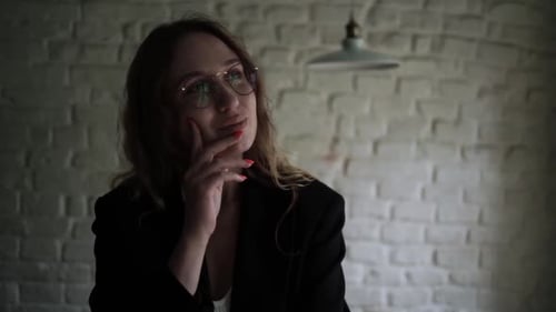 Young Woman Working on Her Laptop Computer in Coffee Shop