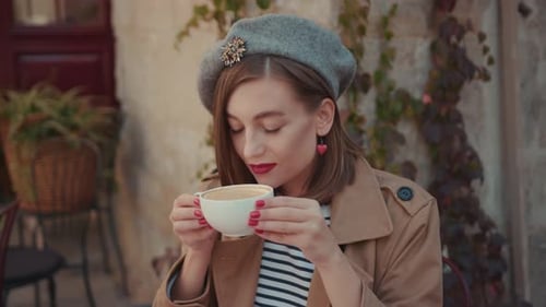 Face Young Woman Sitting in Outside Cafe at Table with Cup of Coffee on Breakfast Croissant Morning