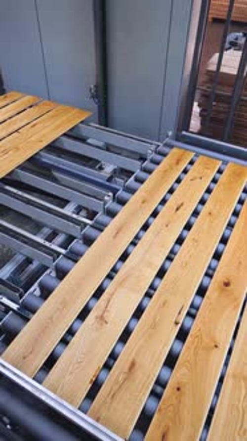 Automated equipment of a parquet factory. Industrial process of furniture production.