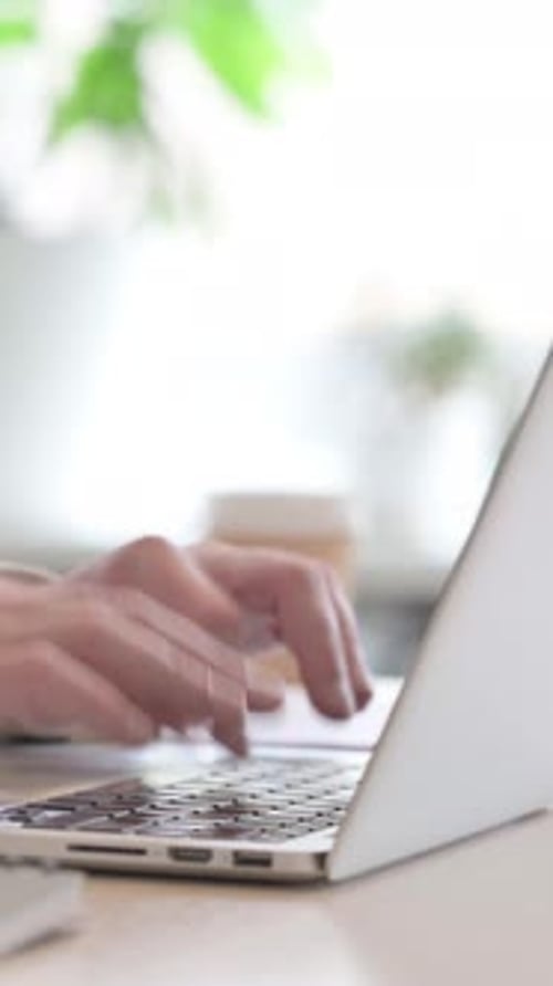Side View of Businessman Working on Laptop, Vertical Video