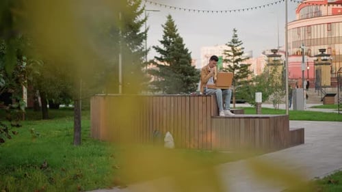 Artist Sketches Outdoors Person Capturing City Landscape in Soft Evening Light An Artist Creating