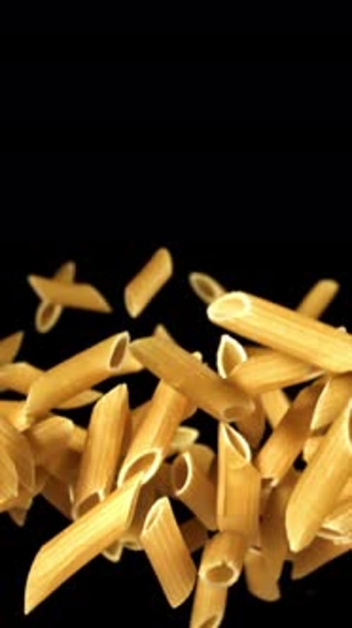 Super Slow Motion Flying Dry Penne Pasta Filmed on a Highspeed Camera at 1000 Fps