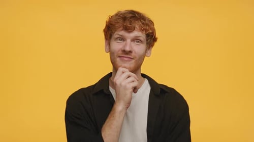 Man Thinking and Crossing Fingers For Good Luck