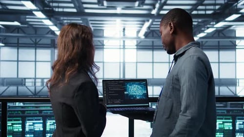 Software Developers in Data Center Using Laptop Employing AI Machine Learning