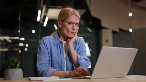 Woman With Pain Using Computer at Office Desk