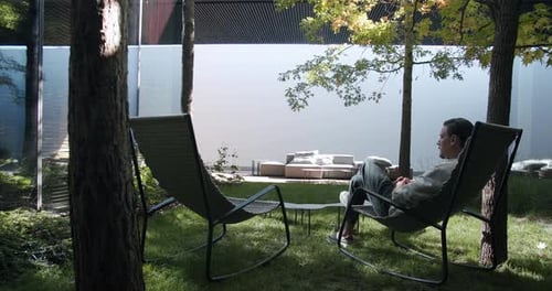 Man Relaxing in a Modern Outdoor Space