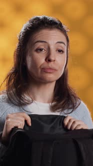 Vertical Video Portrait of Woman Rummaging Through Backpack Taking Book ...