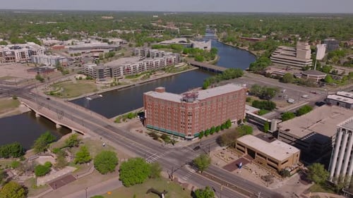 Aerial Perspective of Wichita's Cityscape Featuring a Prominent Structure Arkansas River and Bridges