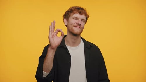 Man With Red Hair Gives Okay Sign