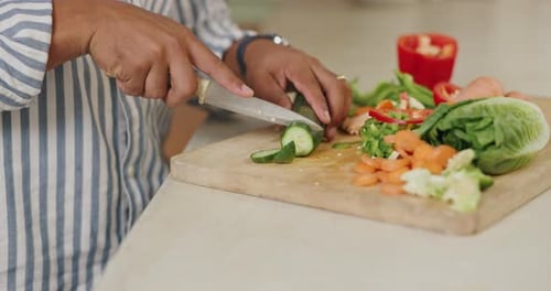 Slicing Fresh Vegetables on a Cutting Board
