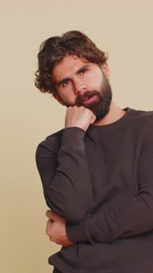 Thoughtful Man Posing with Hand on Chin