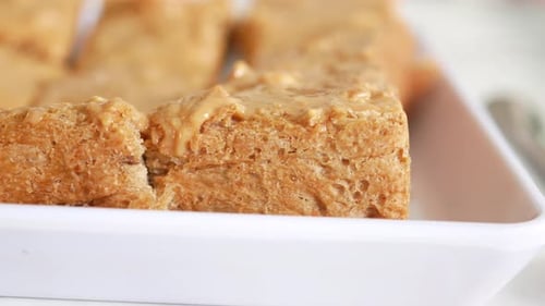 Top View of Peanut Butter and a Bread on Plate on Black Background