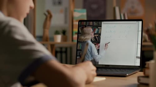 Boy Doing Math Lesson Online With Teacher