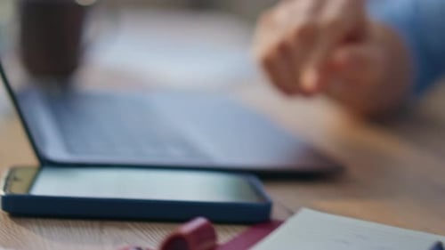 Employee Hands Writing Notebook at Desk Closeup Person Typing Laptop in Office