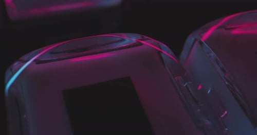 Close-up transparent play and stop button on control panel in pulsating light