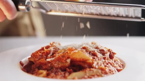 Chef Cooking Penne Pasta with Tomato Sauce and Mozalerra Cheese in Pan Close Up Cooking Traditional