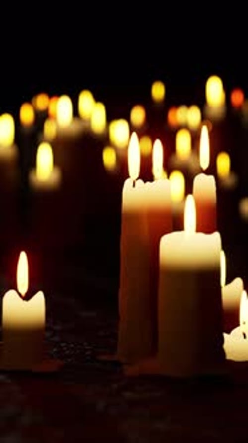 Softly Burning Candles in a Dark Ambient Scene