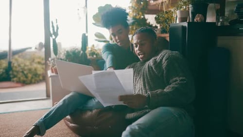 Young Adults Review Documents at Home