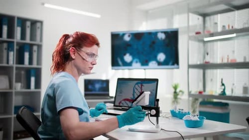Scientist Working in Modern, Clean Laboratory