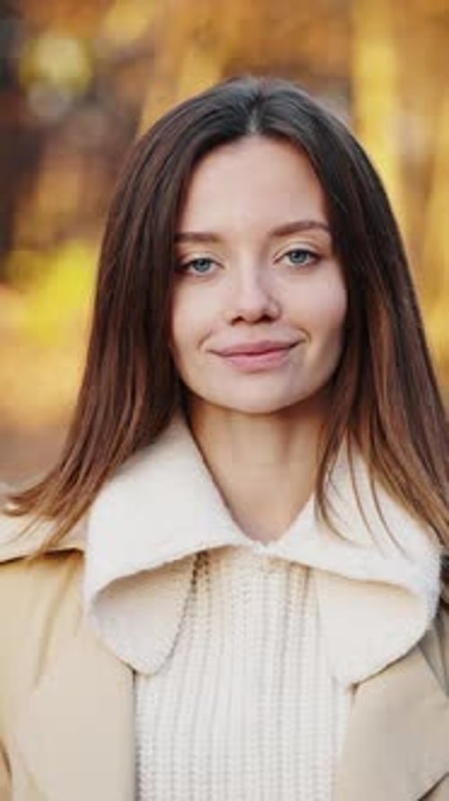 Attractive Woman Smiling Outdoors in Autumn Fashion