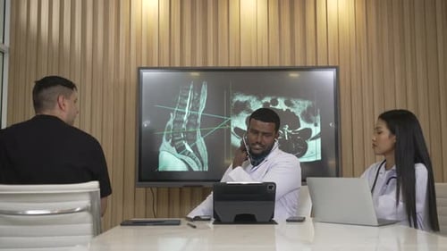 Doctor Examines Patient with Stethoscope in Clinic