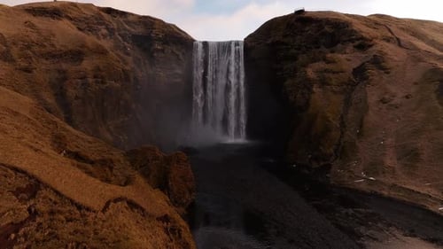 Majestic Skógafoss waterfall cascading down in Skógar, Iceland with Eyjafjallajökull visible