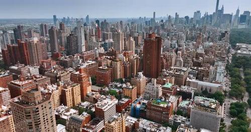 Diversity of New York architecture. Drone footage above the cityscape on bright sunny day.