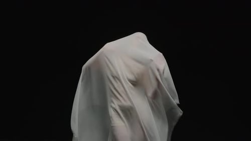 Mysterious Figure Covered with White Sheet Dancing