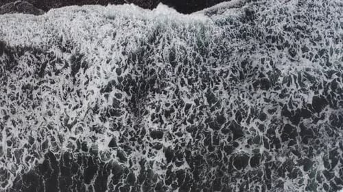 Top Down Aerial View From Drone of Volcanic Black Sand Beach