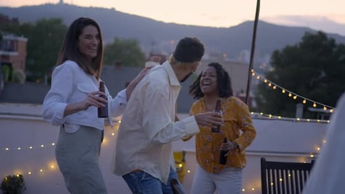 Friends Enjoy Evening Drinks on Rooftop Party