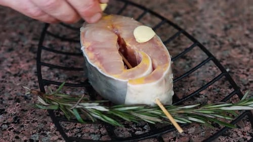 chef prepares a salmon dish in the kitchen. Close-up shots
