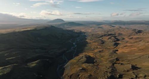 Aerial View Of Rolling Landscapes And Flowing Rivers In Iceland