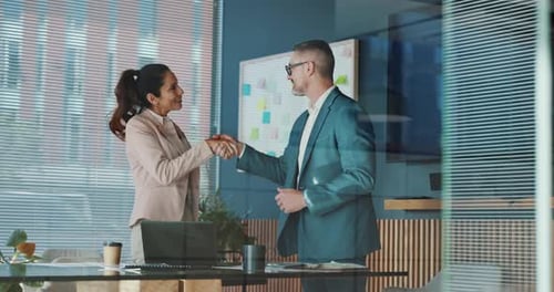 Handshake, deal and business people in office with investment negotiation, agreement or welcome