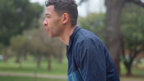 Breathe, running and man in park tired for marathon training, exercise and cardio workout