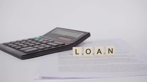Calculator, Loan Tiles, and Financial Documents