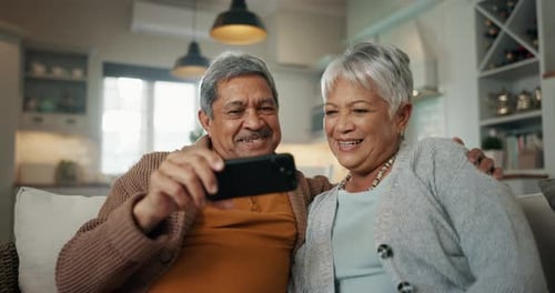 Loving Mature Couple Laughing Together at Home