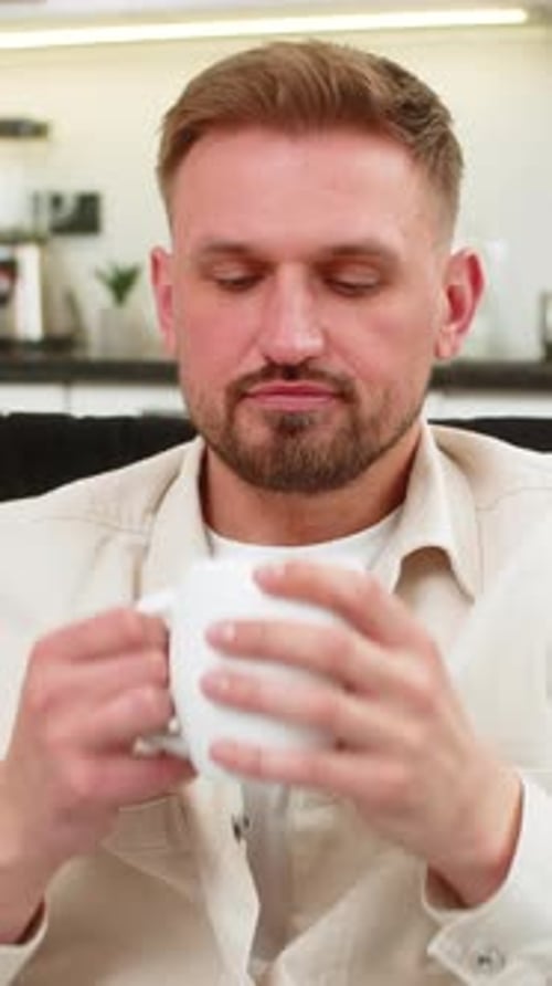 Man Enjoying a Cup of Coffee at Home
