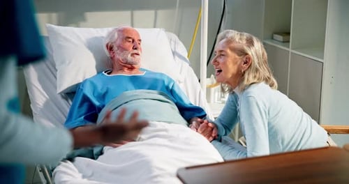 Happy, old couple and listening to nurse, hospital or excited for recovery, healthcare and wellness