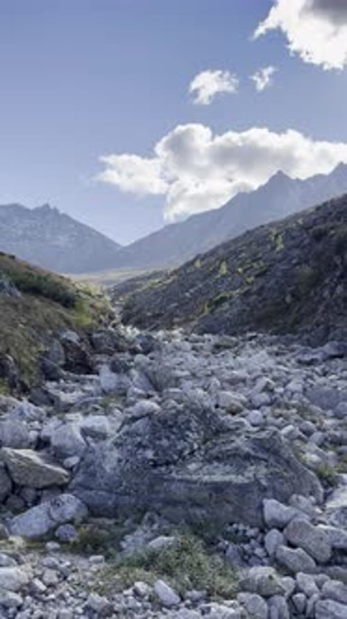 Majestic mountains rise under a bright, clear sky