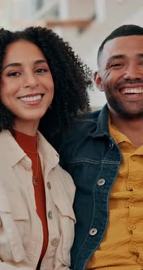 Smiling Young Couple Looking at the Camera